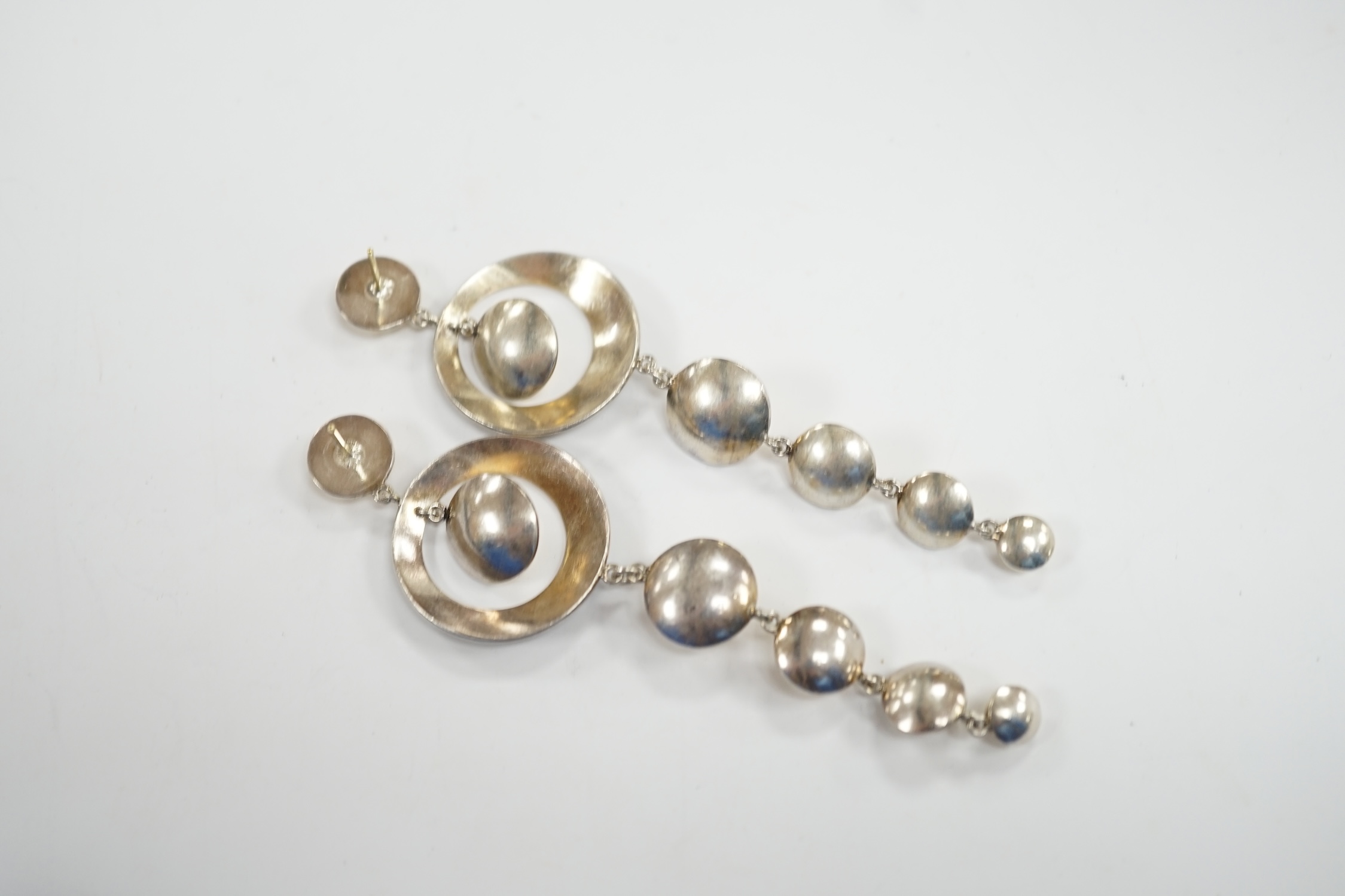 A pair of yellow and white metal diamond and black onyx set graduated disc drop earrings, 93mm, gross weight 23.8 grams.